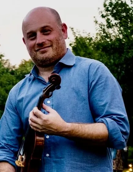 Nate holding his fiddle